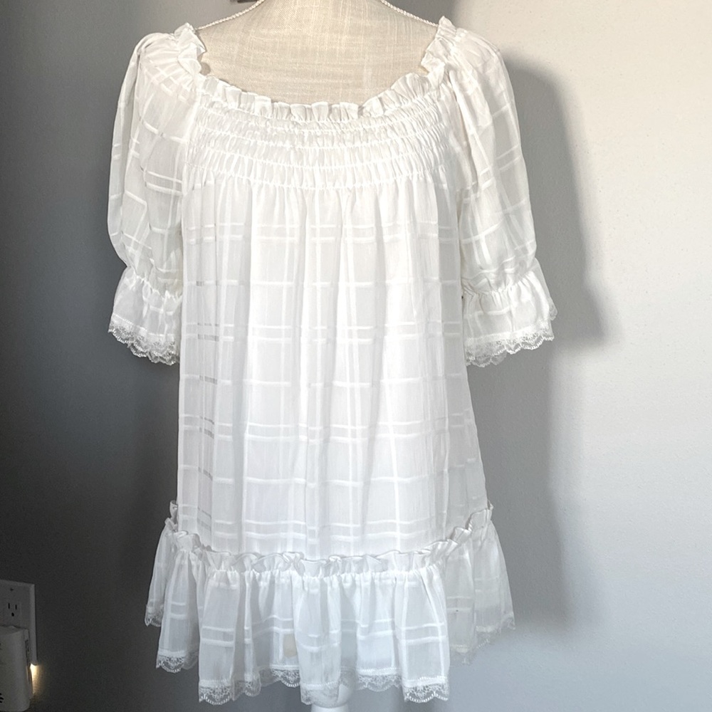 Cream blouse by sequin hearts.